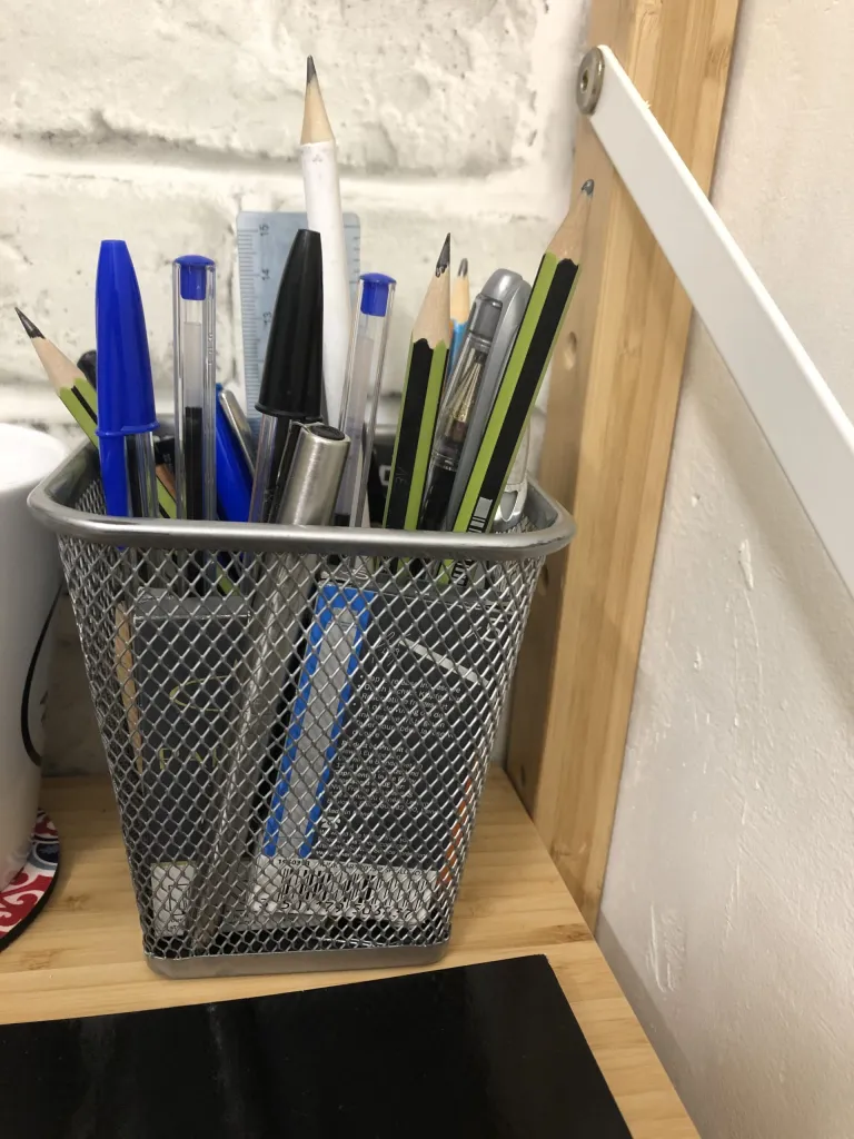 Photo of André’s pen holder stuffed with pens.